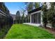 A lush lawn is fenced in and provides access to a home's outdoor seating areas at 1991 E Alameda Ave # 14, Denver, CO 80209