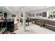 Finished basement with wet bar, foosball table, shuffleboard, and seating area at 1991 E Alameda Ave # 14, Denver, CO 80209