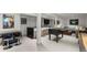 Entertainment room featuring arcade games, a wet bar, foosball table, and a comfortable sofa at 1991 E Alameda Ave # 14, Denver, CO 80209