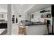 Finished basement featuring a wet bar with countertop seating at 1991 E Alameda Ave # 14, Denver, CO 80209