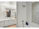 A clean and bright bathroom design including a bathtub, shower, and a rainbow mural at 1991 E Alameda Ave # 14, Denver, CO 80209