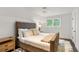 Cozy bedroom featuring a tufted headboard, soft textures, and a plush rug at 1991 E Alameda Ave # 14, Denver, CO 80209