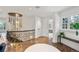 Bright hallway features hardwood floors, decorative railing, a modern light fixture, and plenty of natural light at 1991 E Alameda Ave # 14, Denver, CO 80209
