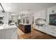 Bright kitchen featuring a marble island, stainless steel appliances, and custom cabinets at 1991 E Alameda Ave # 14, Denver, CO 80209