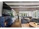 Elegant living room with a fireplace, hardwood floors, comfortable seating, and an open floor plan at 1991 E Alameda Ave # 14, Denver, CO 80209