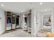 Mud room featuring custom storage and bench with access to the garage at 1991 E Alameda Ave # 14, Denver, CO 80209