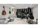 Music studio equipped with soundproofing, instruments, and comfortable seating at 1991 E Alameda Ave # 14, Denver, CO 80209