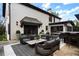Entertain on this beautiful outdoor patio, adjacent to home, featuring a kitchen, dining and living area at 1991 E Alameda Ave # 14, Denver, CO 80209