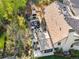 Aerial view of a sprawling outdoor patio complete with a full kitchen, fireplace and comfortable seating at 1991 E Alameda Ave # 14, Denver, CO 80209