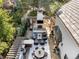 Comfortable outdoor living with fireplace, covered seating, barbecue area, and outdoor dining at 1991 E Alameda Ave # 14, Denver, CO 80209