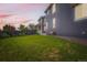 Spacious backyard bordered by a black fence and landscaped with a well maintained lawn at 3597 Xanthia St, Denver, CO 80238