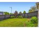 Lush backyard featuring green lawn and tasteful landscaping at 3597 Xanthia St, Denver, CO 80238