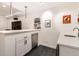 Basement wet bar with stylish bar and appliances at 3597 Xanthia St, Denver, CO 80238