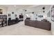 Finished basement with large entertainment area featuring a TV and sound system at 3597 Xanthia St, Denver, CO 80238