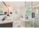 Bright bathroom with a freestanding tub, glass-enclosed shower and double vanity sinks at 3597 Xanthia St, Denver, CO 80238