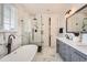 Beautiful bathroom with standalone tub, glass shower, and modern fixtures offering a spa-like experience at 3597 Xanthia St, Denver, CO 80238