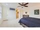 Bedroom featuring neutral walls, plush carpet and a modern platform bed with ample windows at 3597 Xanthia St, Denver, CO 80238