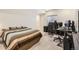 Bedroom with neutral carpet, modern decor, and an office area with multiple monitors at 3597 Xanthia St, Denver, CO 80238