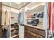 Spacious walk-in closet with custom shelving and drawers providing organized storage solutions at 3597 Xanthia St, Denver, CO 80238