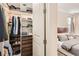 Organized closet featuring shelves, hanging rods, and built-in wooden drawers for ample storage at 3597 Xanthia St, Denver, CO 80238