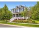 Charming two-story home with a welcoming front porch and professionally landscaped yard at 3597 Xanthia St, Denver, CO 80238