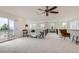 Upstairs loft with plenty of light from slider and windows, modern railings and ceiling fan at 3597 Xanthia St, Denver, CO 80238
