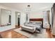 Comfortable main bedroom featuring a luxurious king bed, neutral decor, and recessed lighting at 3597 Xanthia St, Denver, CO 80238
