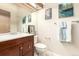 Bathroom featuring vanity, toilet, and framed art at 4636 S Dillon Ct # B, Aurora, CO 80015