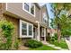 The townhome has a stone and siding facade, lush lawn, and welcoming front entrance at 4636 S Dillon Ct # B, Aurora, CO 80015