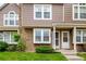 Townhouse with stone and vinyl exterior, pristine lawn, and a welcoming front entrance at 4636 S Dillon Ct # B, Aurora, CO 80015