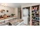A kitchen area with washer and dryer, as well as open pantry shelving at 4636 S Dillon Ct # B, Aurora, CO 80015