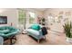 Sitting area with a couch, natural light, and stylish decor at 4636 S Dillon Ct # B, Aurora, CO 80015