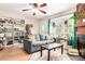 Comfortable living room with a ceiling fan, hardwood floors, and a large window at 4636 S Dillon Ct # B, Aurora, CO 80015