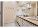 Bathroom featuring double sinks, ample vanity storage, and neutral color palette at 835 Niagara St, Denver, CO 80220