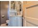 Charming bathroom with marble countertop, vintage fixtures, and patterned tile flooring at 835 Niagara St, Denver, CO 80220