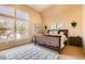 Bright bedroom features large windows, vaulted ceilings, and neutral decor at 835 Niagara St, Denver, CO 80220