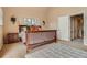 Comfortable bedroom with a queen-sized bed, side tables, and neutral-toned walls at 835 Niagara St, Denver, CO 80220