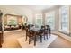 Bright dining room featuring a large table, natural light, and seamless flow to the adjacent living space at 835 Niagara St, Denver, CO 80220