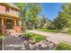 Charming home featuring a welcoming front entrance with manicured landscaping and a lovely porch at 835 Niagara St, Denver, CO 80220