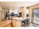 Bright kitchen features a breakfast bar, stainless steel appliances, and hardwood floors at 835 Niagara St, Denver, CO 80220