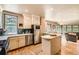 Updated kitchen features stainless appliances, marble countertops, and a large adjacent living area at 835 Niagara St, Denver, CO 80220