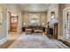 Cozy living room with fireplace, large windows, and neutral decor offering a warm and inviting ambiance at 835 Niagara St, Denver, CO 80220