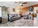 Comfortable living room featuring a textured rug, wood paneling, and a relaxed seating arrangement at 4942 W 9Th Ave, Denver, CO 80204