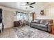 Spacious living room with a ceiling fan and a large window that provides ample natural light at 4942 W 9Th Ave, Denver, CO 80204