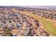 A single Gathering home is seen from above in a residential area near a large green golf course area at 1339 Bent Grass Cir, Castle Rock, CO 80109