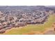 An aerial view of a single-Gathering home located near a well-maintained golf course and green space at 1339 Bent Grass Cir, Castle Rock, CO 80109