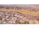 An aerial view of a well-maintained single-Gathering home in a quiet residential neighborhood near a green area at 1339 Bent Grass Cir, Castle Rock, CO 80109