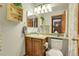 This bathroom has a vanity with a sink, decorative shelf, and a neutral color scheme at 1339 Bent Grass Cir, Castle Rock, CO 80109