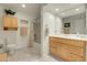 Bright bathroom with maple cabinets and a shower and tub combo at 1339 Bent Grass Cir, Castle Rock, CO 80109