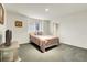 Neutral bedroom with an area rug, closet and a double window at 1339 Bent Grass Cir, Castle Rock, CO 80109